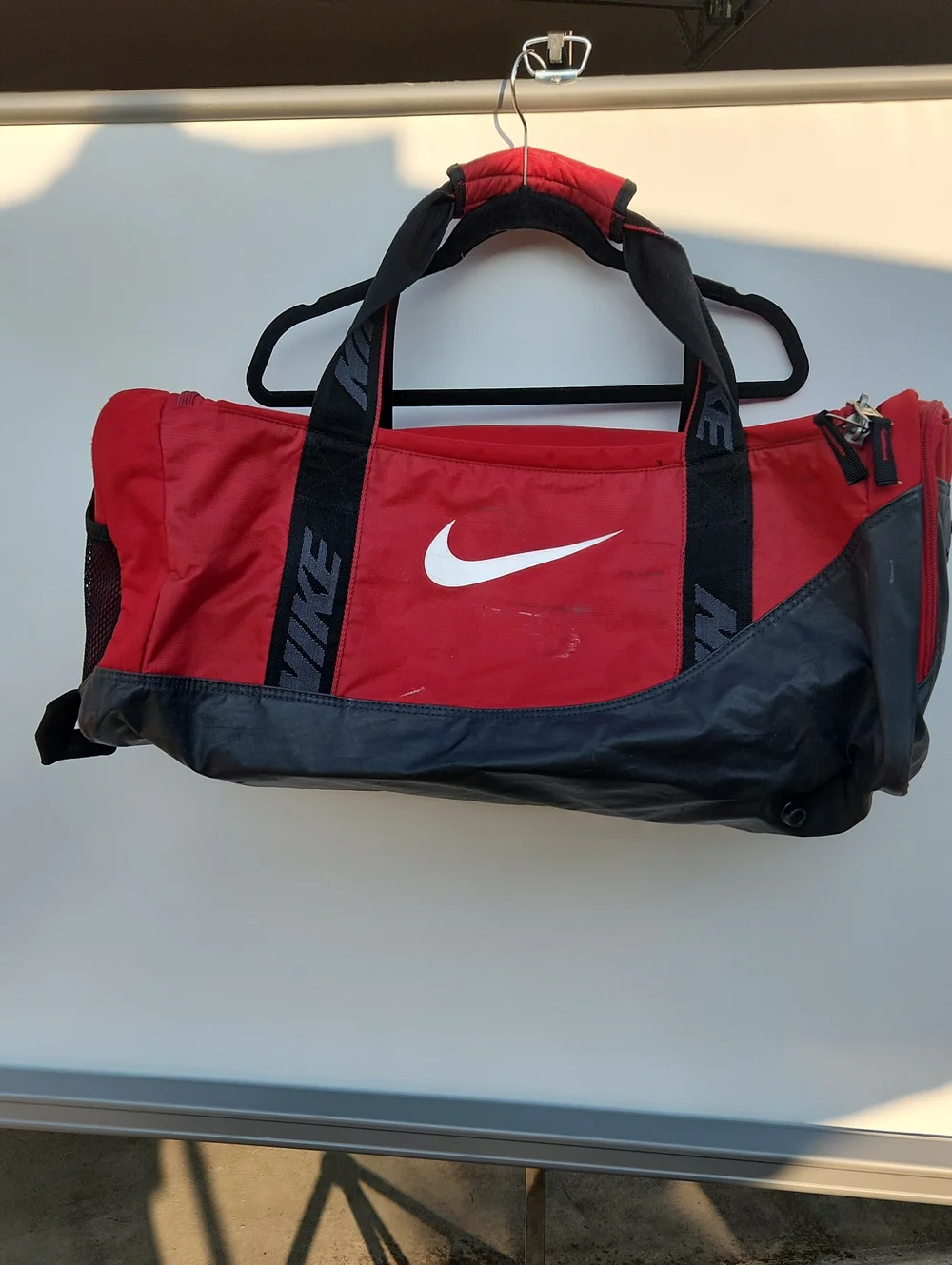 Nike Red and Black Sports Duffel Bag with White Swoosh